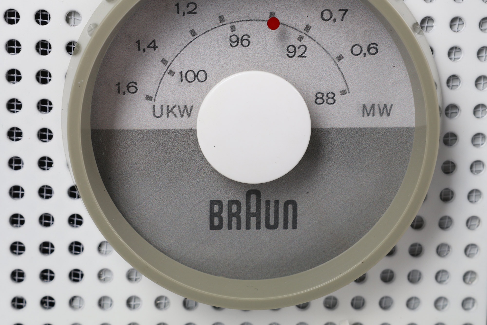 The tuning knob, frequency scale, and perforated grille of a Braun SK2 radio