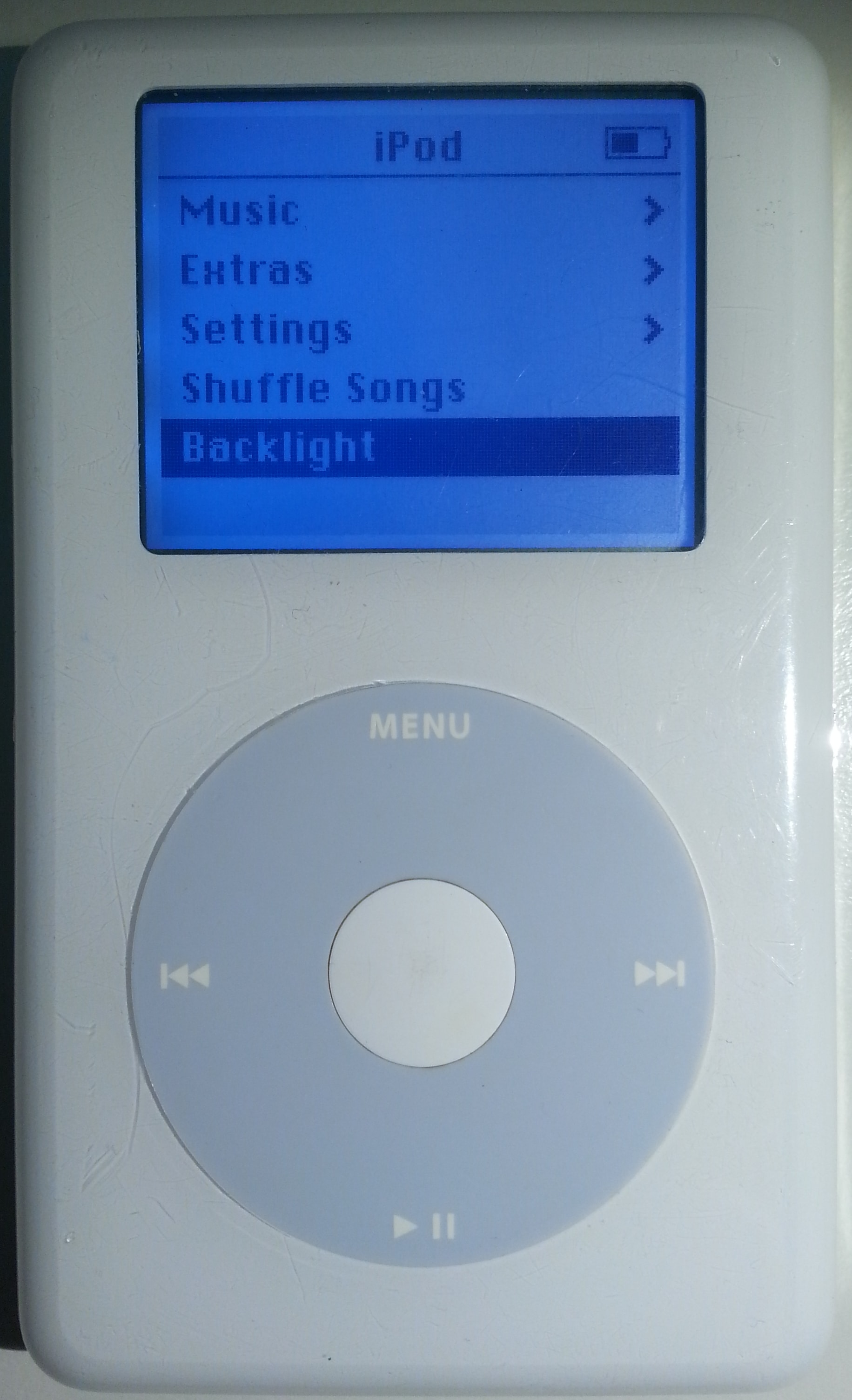 The gray Click Wheel, playback symbols, and white center button on a fourth-generation iPod